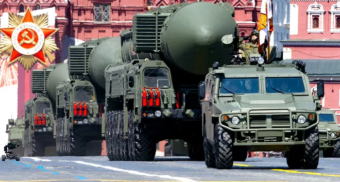 FILE - In this file photo taken on Wednesday, June 24, 2020, Russian RS-24 Yars ballistic missiles roll in Red Square during the Victory Day military parade marking the 75th anniversary of the Nazi defeat in Moscow, Russia. Russia and the United States exchanged documents Tuesday Jan. 26, 2021, to extend the New START nuclear treaty, their last remaining arms control pact, the Kremlin said. The Kremlin readout of a phone call between U.S. President Joe Biden and Russian President Vladimir Putin said they voiced satisfaction with the move. (AP Photo/Alexander Zemlianichenko, File)