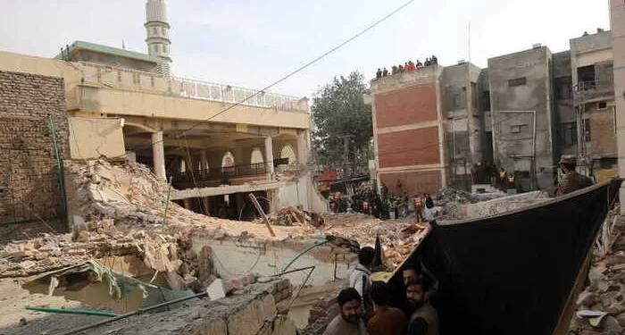 epa10440922 Rescue workers search for victims amid debris a day after a suicide bomb blast at a Mosque in Police Lines, in Peshawar, KPK province, Pakistan, 31 January 2023. The death toll from the suicide bombing has reached 92, police said on 31 January. Most of the deceased in the  attack, one of the deadliest ever staged on law enforcement authorities in Pakistan's history, are police and other members of the security forces.  EPA/ARSHAD ARBAB