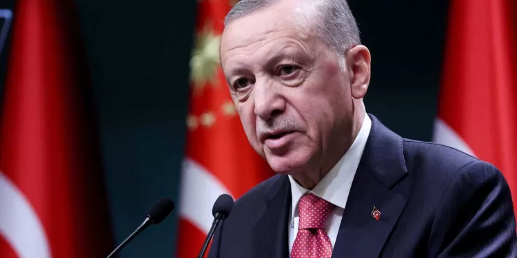 Turkish President Recep Tayyip Erdogan addresses the floor after signing the decree announcing that national general elections will he held on May 14, at the Presidential Complex or Kulliye in Ankara on March 10, 2023. (Photo by Adem ALTAN / AFP)