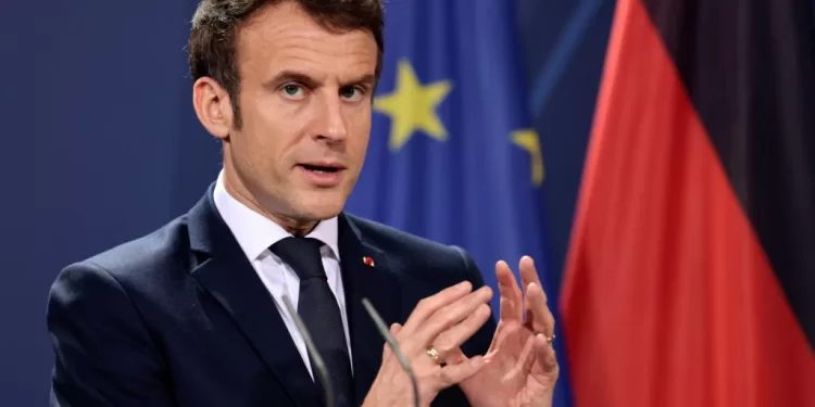 French President Emmanuel Macron speaks to the media ahead of a Weimar Triangle meeting to discuss the ongoing Ukraine crisis, in Berlin, Germany, February 8, 2022. REUTERS/Hannibal Hanschke/Pool