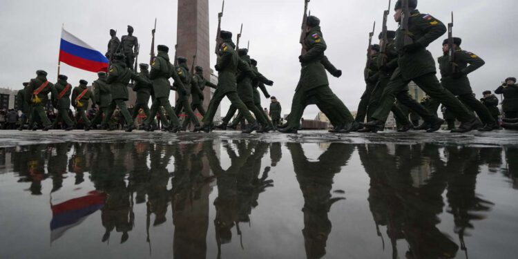 Russian army soldiers attend an event marking the 80th anniversary of the break of Nazi's siege of Leningrad, (now St. Petersburg) during World War II at the monument of the Heroic Defenders of Leningrad, in St. Petersburg, Russia, Wednesday, Jan. 18, 2023. The Red Army broke the nearly 900-day blockade of the city on January 18, 1943 after fierce fighting. (AP Photo/Dmitri Lovetsky)