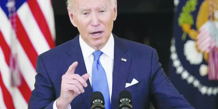 U.S. President Joe Biden speaks about the country's fight against the coronavirus disease (COVID-19) at the White House in Washington, U.S., December 21, 2021. REUTERS/Kevin Lamarque