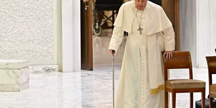 Pope Francis arrives for the weekly general audience in Paul-VI hall at the Vatican on December 13, 2023. (Photo by Andreas SOLARO / AFP)