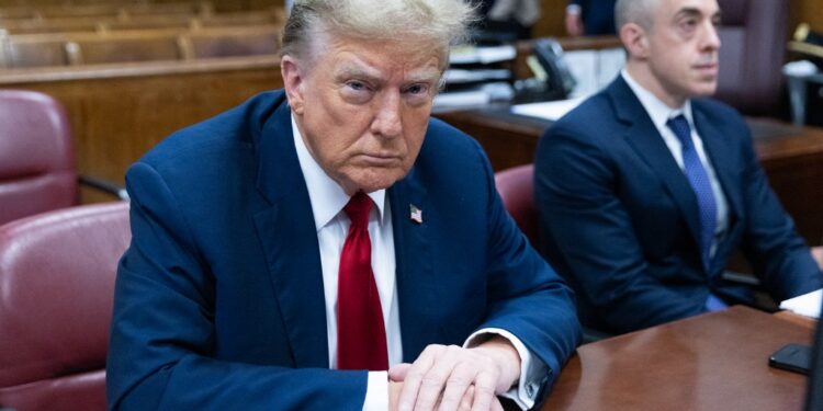 Former US President Donald Trump attends the first day of his trial for allegedly covering up hush money payments linked to extramarital affairs, at Manhattan Criminal Court in New York City on April 15, 2024. Donald Trump is in court Monday as the first US ex-president ever to be criminally prosecuted, a seismic moment for the United States as the presumptive Republican nominee campaigns to re-take the White House. The scandal-plagued 77-year-old is accused of falsifying business records in a scheme to cover up an alleged sexual encounter with adult film actress Stormy Daniels to shield his 2016 election campaign from adverse publicity. (Photo by JEENAH MOON / POOL / AFP)