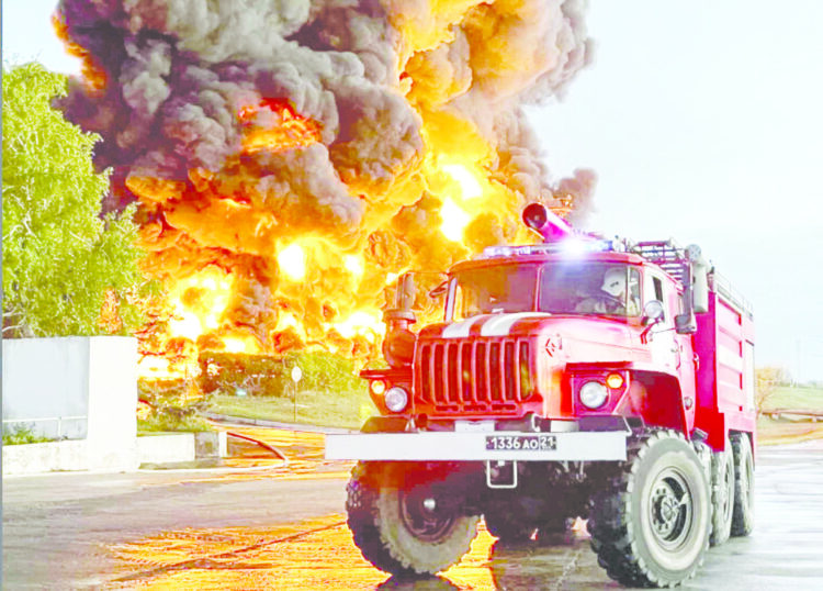 epa10598028 A handout picture made available by the Governor of Sevastopol’s press service shows firefighters deployed to extinguish a fire at an oil depot in Sevastopol, Crimea, 29 April 2023. The Governor of Sevastopol confirmed that a fuel tank caught fire in the Sevastopol port area in the morning of 29 April, and that, according to preliminary information, the fire occurred following an unmanned aerial vehicles (UAV) strike. The fire covered an area of ​​about 1,000 square meters. No casualties were reported. EPA/SEVASTOPOL GOVERNOR PRESS SERVICE HANDOUT HANDOUT EDITORIAL USE ONLY/NO SALES HANDOUT EDITORIAL USE ONLY/NO SALES